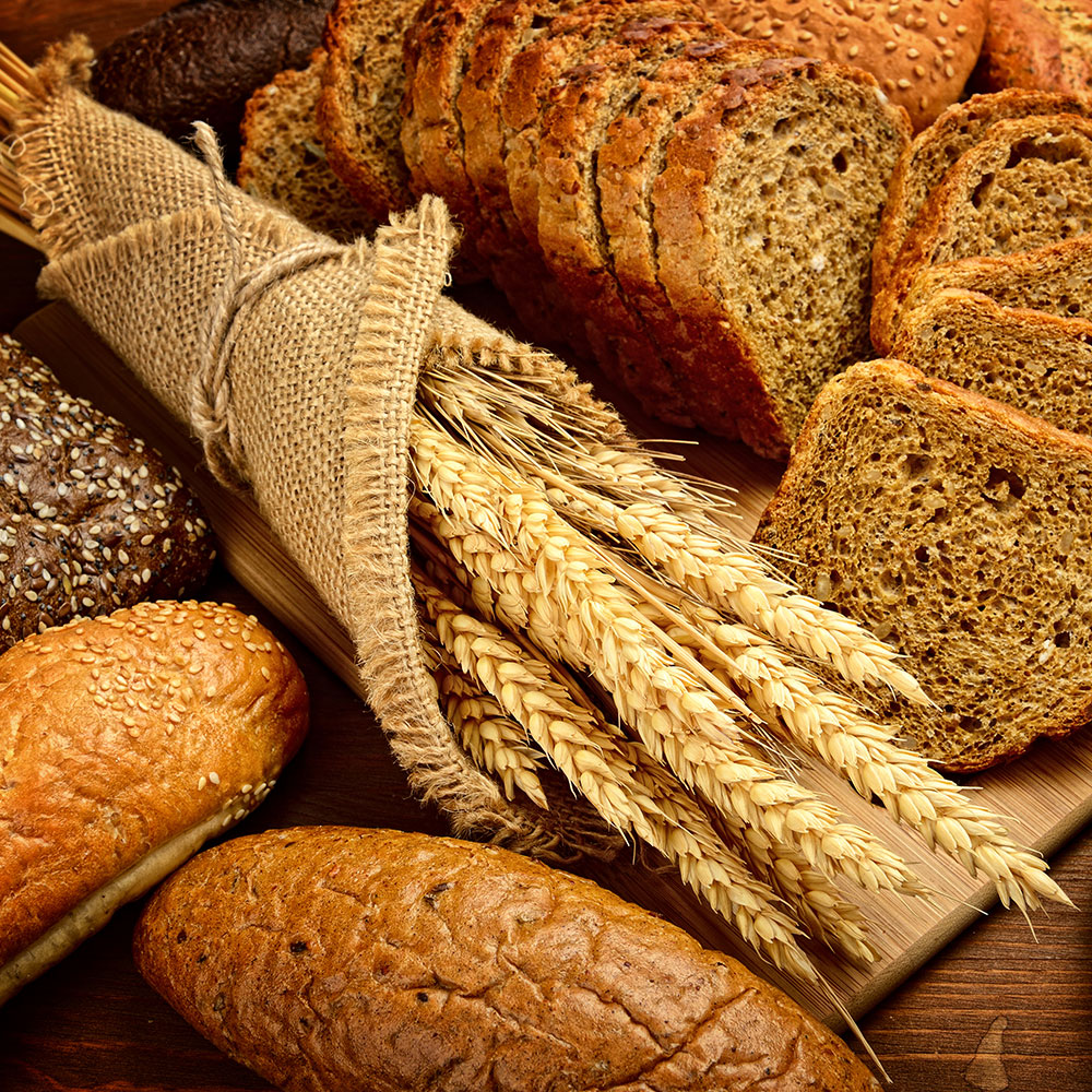 Wheat wrapped in linen with slices of bread, breadrolls